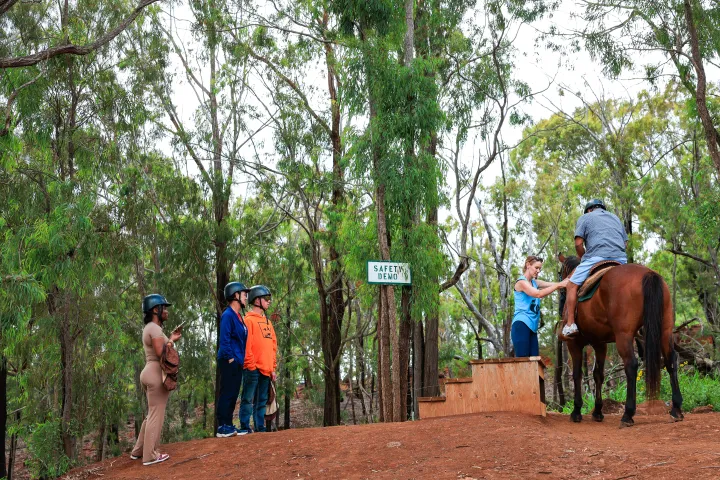 Safety orientation before a horseback trail ride at Palehua Trail Rides