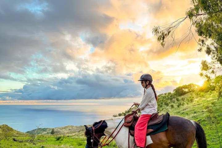 Sunset over the Pacific Ocean while horseback riding in Oahu, Hawaii